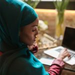 DevOps Culture - Woman Wearing Turban Working on Laptop