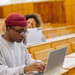 Education Tech - Man in Gray Sweater Using Macbook Air