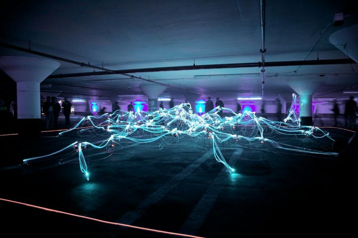 Digital - linked neon lights under white painted basement