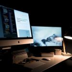 Website - silver iMac turned on inside room